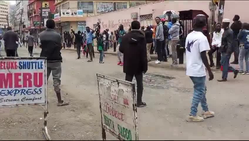 Protesters voices rising in song as they lament the failures of the current leadership. Their chants echo a deep sense of frustration with the present administration, highlighting the issues they believe have been neglected or mishandled